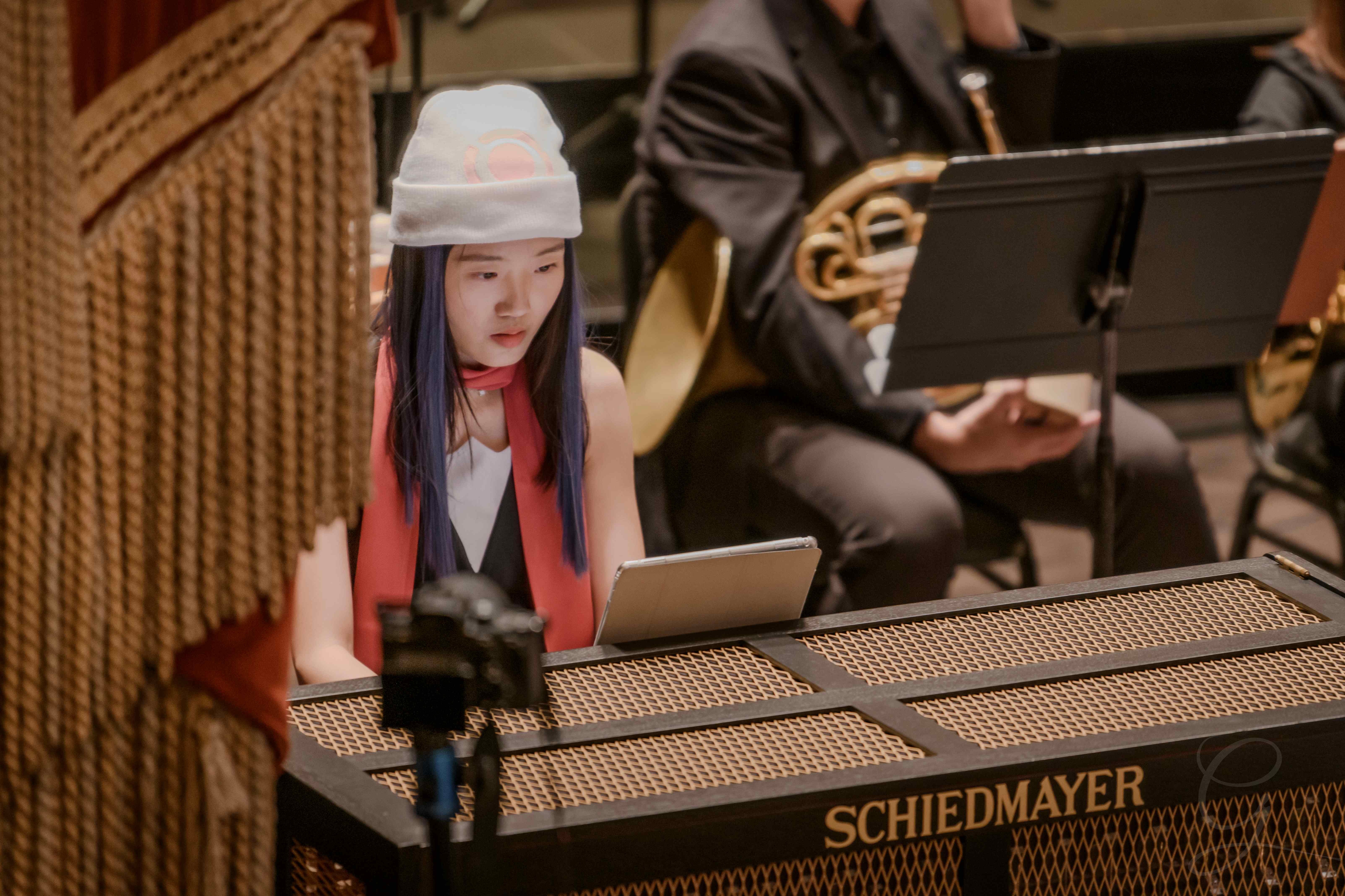 Musician performing on a Schiedmayer celesta during a GG Orchestra concert