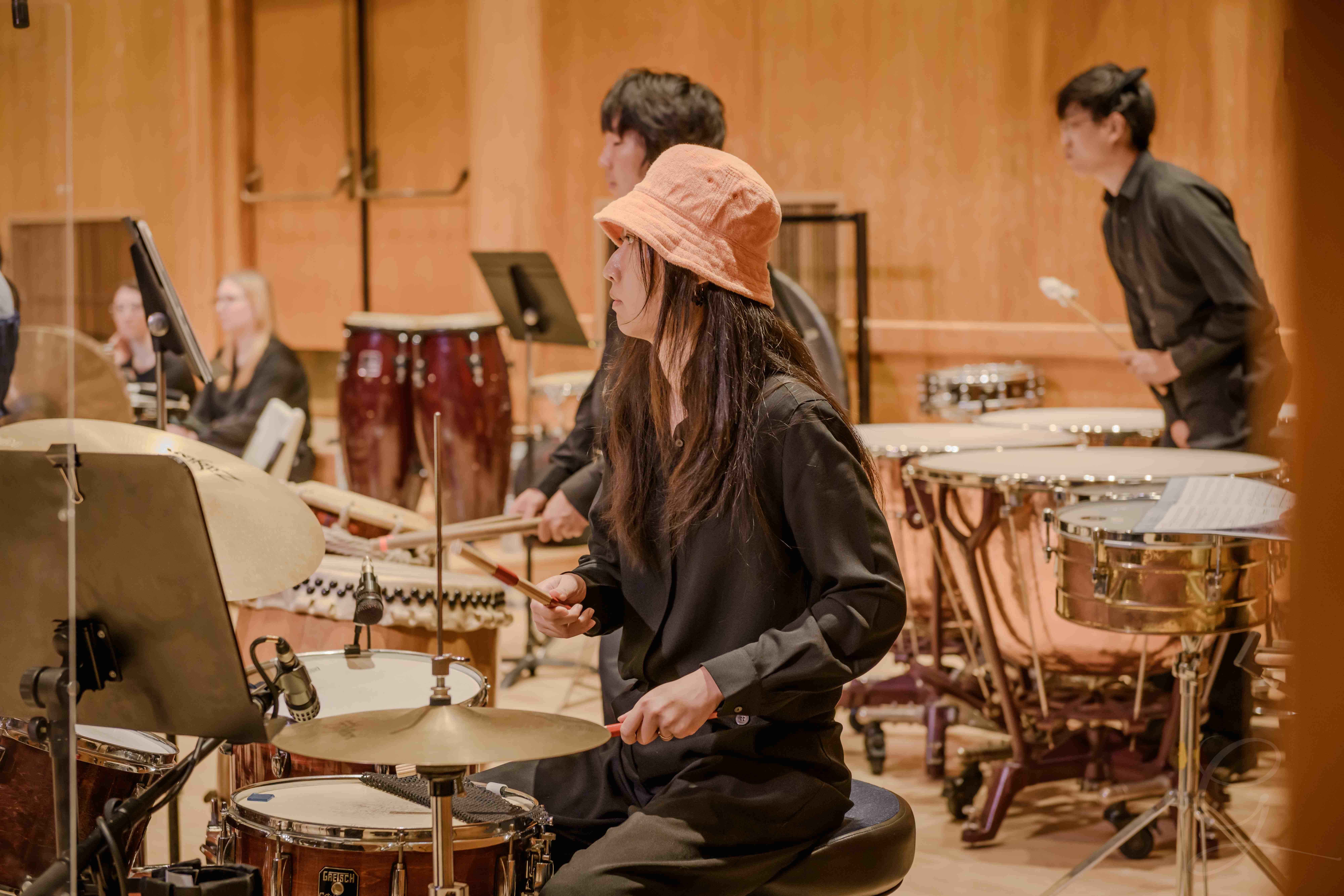 Percussionist performing with drums and timpani during a GG Orchestra concert